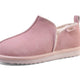 Pink suede slipper with cozy shearling lining, soft sole, and pull tab for easy wear