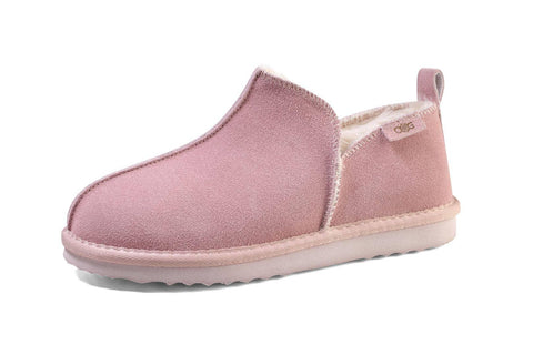 Pink suede slipper with cozy shearling lining, soft sole, and pull tab for easy wear