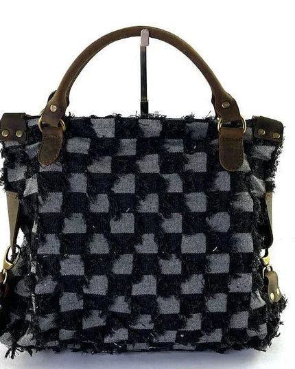 Handcrafted checkered tote bag with frayed texture and leather handles, luxury designer accessory