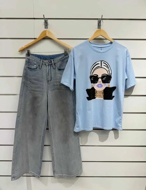 Light blue graphic tee with stylish woman print paired with wide-leg denim jeans, modern casual outfit
