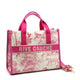 Pink Rive Gauche tote bag with jungle print, leather trim, and gold hardware