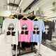 Stylish graphic tees with bold sunglasses print in white, pink, blue, black — modern designer fashion