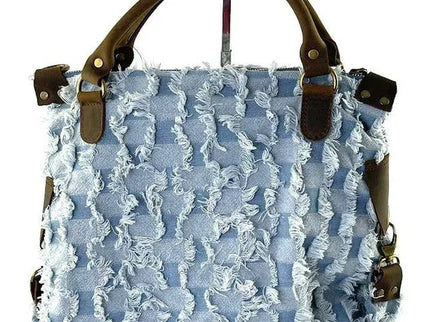 Light blue frayed denim handbag with brown leather handles and hardware, luxury designer accessory