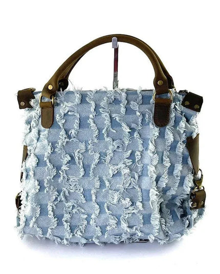 Light blue frayed denim handbag with brown leather handles and hardware, luxury designer accessory