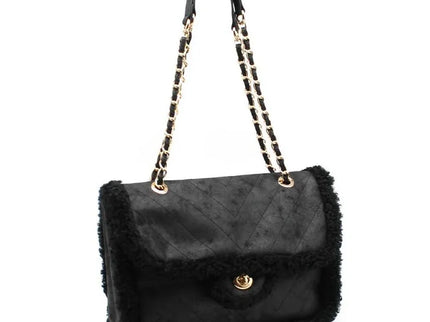 Luxury black quilted handbag with shearling trim and gold chain strap, designer fashion accessory