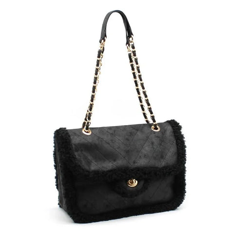 Luxury black quilted handbag with shearling trim and gold chain strap, designer fashion accessory