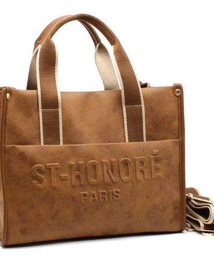 Brown leather tote bag with ST-HONORÉ PARIS embossing, canvas straps, and detachable shoulder strap