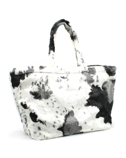 Black and white cow print faux fur tote bag with top handles, luxury designer accessory