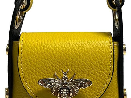 Vibrant yellow leather handbag with black trim and metallic bee embellishment, luxury designer accessory.
