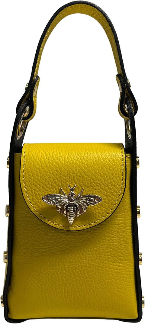 Vibrant yellow leather handbag with black trim and metallic bee embellishment, luxury designer accessory.