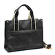 Black leather tote bag with 'ST-HONORÉ PARIS' embossing, gold hardware, and contrast straps