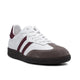 White and burgundy suede sneaker with 'London' text, classic retro design, premium craftsmanship