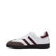 White sneaker with burgundy stripes and brown suede toe, classic retro design