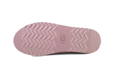 Pink shoe sole with zigzag tread and OOG Generation logo, showcasing durable design for luxury footwear.