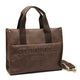 Brown leather tote bag with ST-HONORÉ PARIS embossing, dual handles, and detachable strap