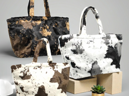 Printed bag with cow pattern and long, soft handles 