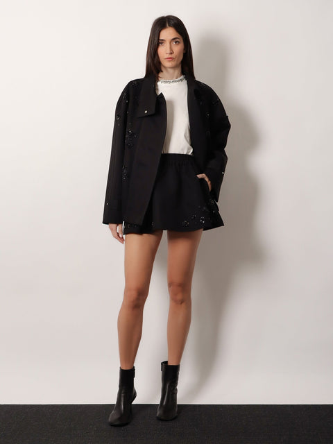 Black denim jacket with floral details in sequins and crystals