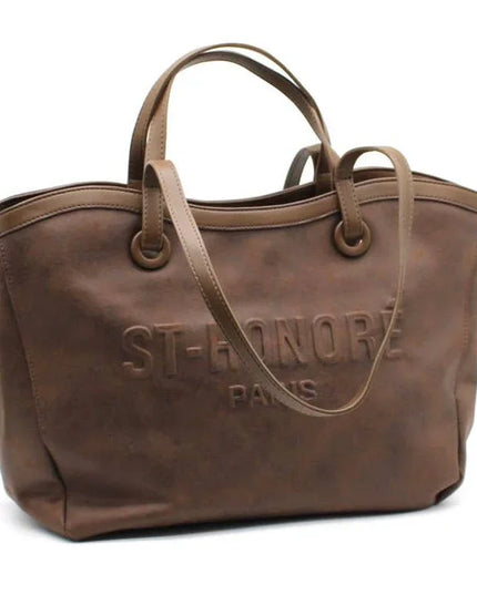 Brown leather tote bag with embossed ST-HONORÉ PARIS logo, dual handles, and shoulder strap for everyday luxury style.