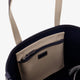 Canvas shoulder bag with embroidered logo on the front