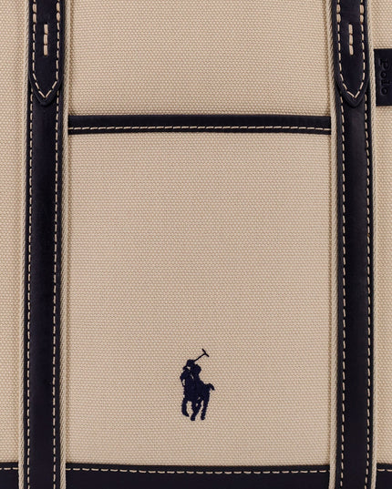 Canvas shoulder bag with embroidered logo on the front