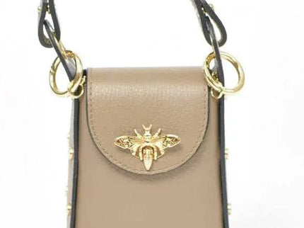 Beige leather handbag with gold bee clasp and studded details, luxury designer accessory