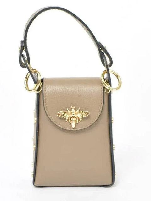 Beige leather handbag with gold bee clasp and studded details, luxury designer accessory