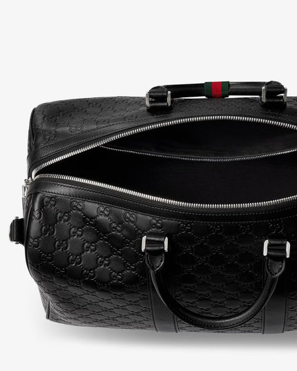 Coated canvas GG Emblem travel bag with GG motif