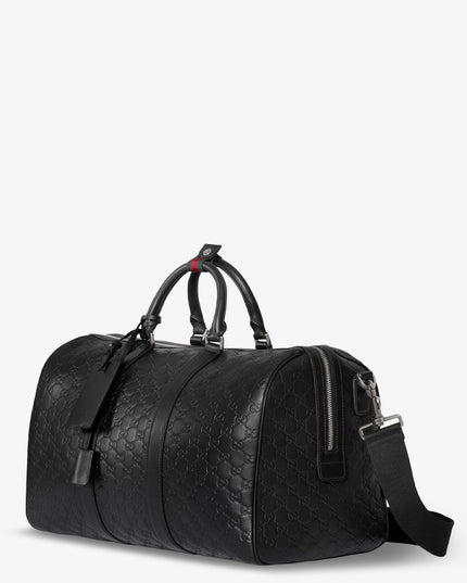 Coated canvas GG Emblem travel bag with GG motif