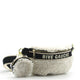 Fluffy white shearling fanny pack with 'RIVE GAUCHE' strap, gold zipper, and matching pouch