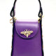 Purple leather handbag with gold bee clasp, black trim, and top handle. Luxury designer accessory.