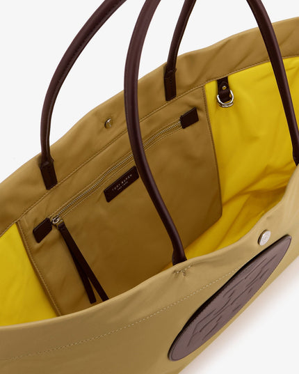 Ella Twist nylon shoulder bag with maxi logo patch on the front