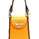 Vibrant orange leather handbag with gold bee clasp and black trim, luxury designer accessory