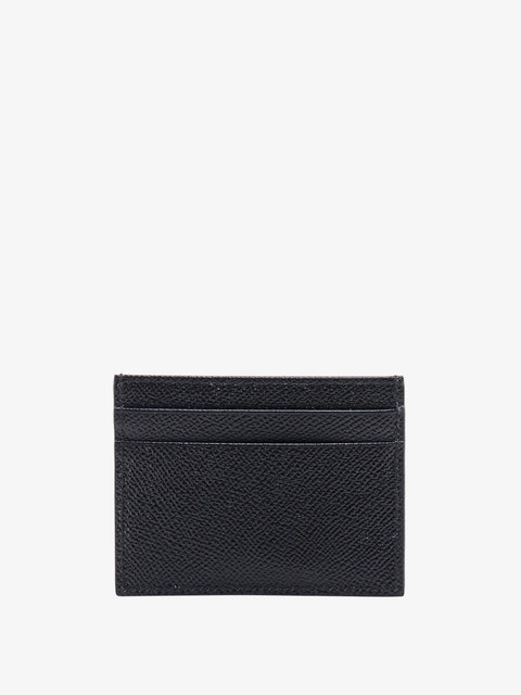 Leather card holder with metal logo tag