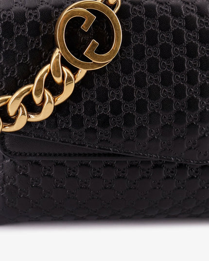 Leather crossbody bag with embossed GG motif