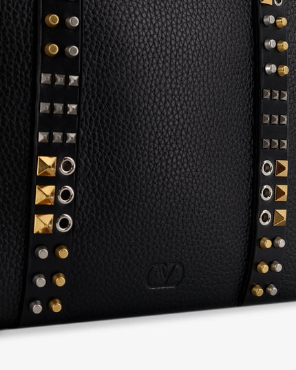Leather shoulder bag with iconic studs