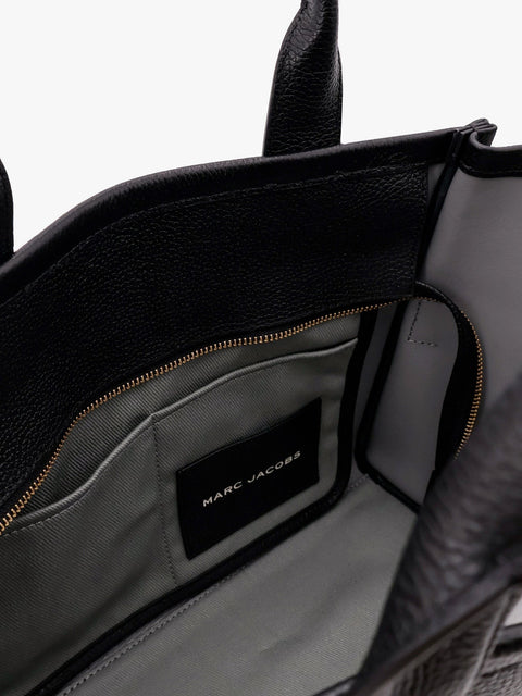 Leather shoulder bag with logo on the front