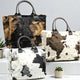 BIG Kuschel Shopper Felltasche mit Kuhmuster und festem Griff in 3 Farben - ModeEcho